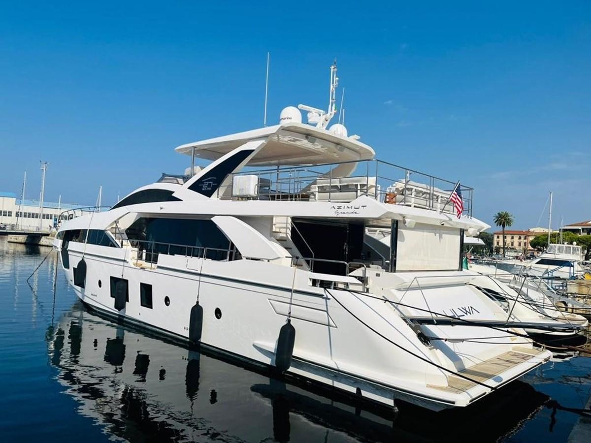 a large white boat in a harbor aboard LULWA Yacht for Sale