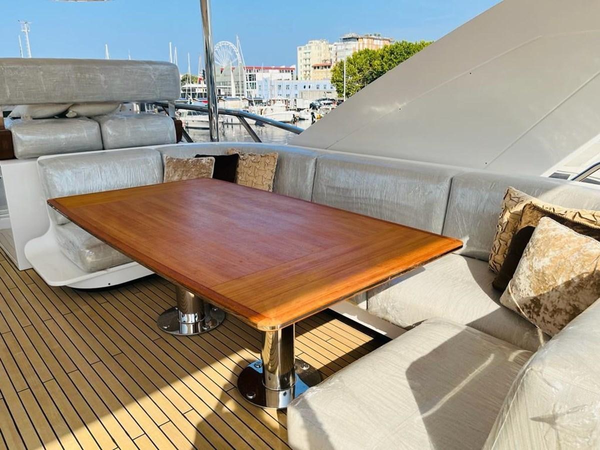 a table on a balcony aboard LULWA Yacht for Sale