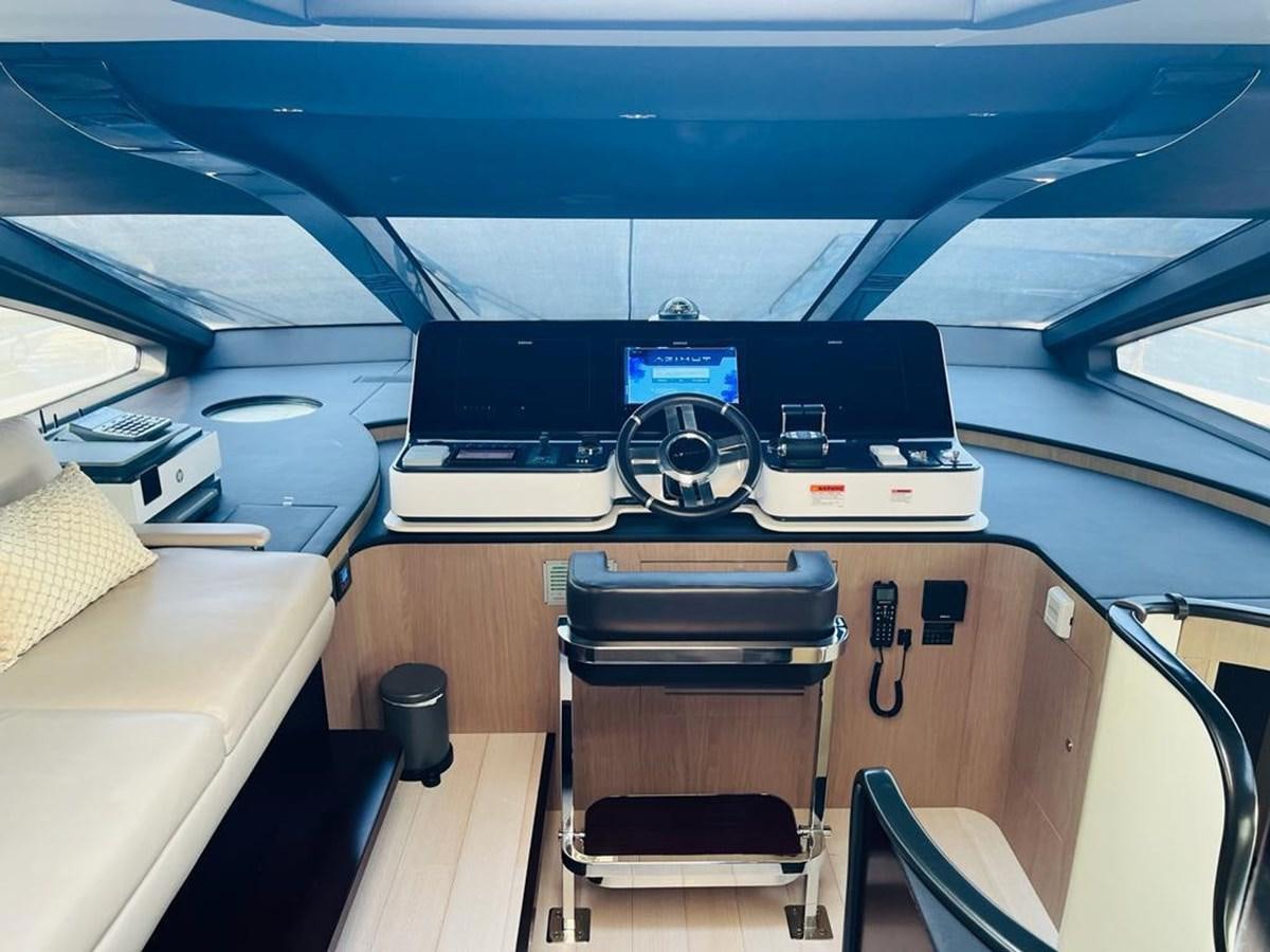 a desk with a computer and other office equipment on it aboard LULWA Yacht for Sale