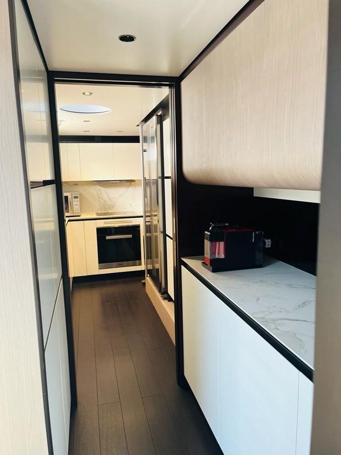 a hallway with a computer and a desk aboard LULWA Yacht for Sale