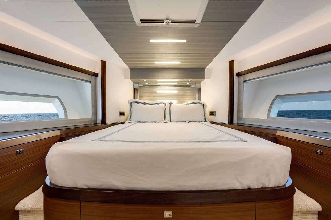 a bed in a room aboard 2018 OCEAN ALEXANDER 70E TIRESUM Yacht for Sale