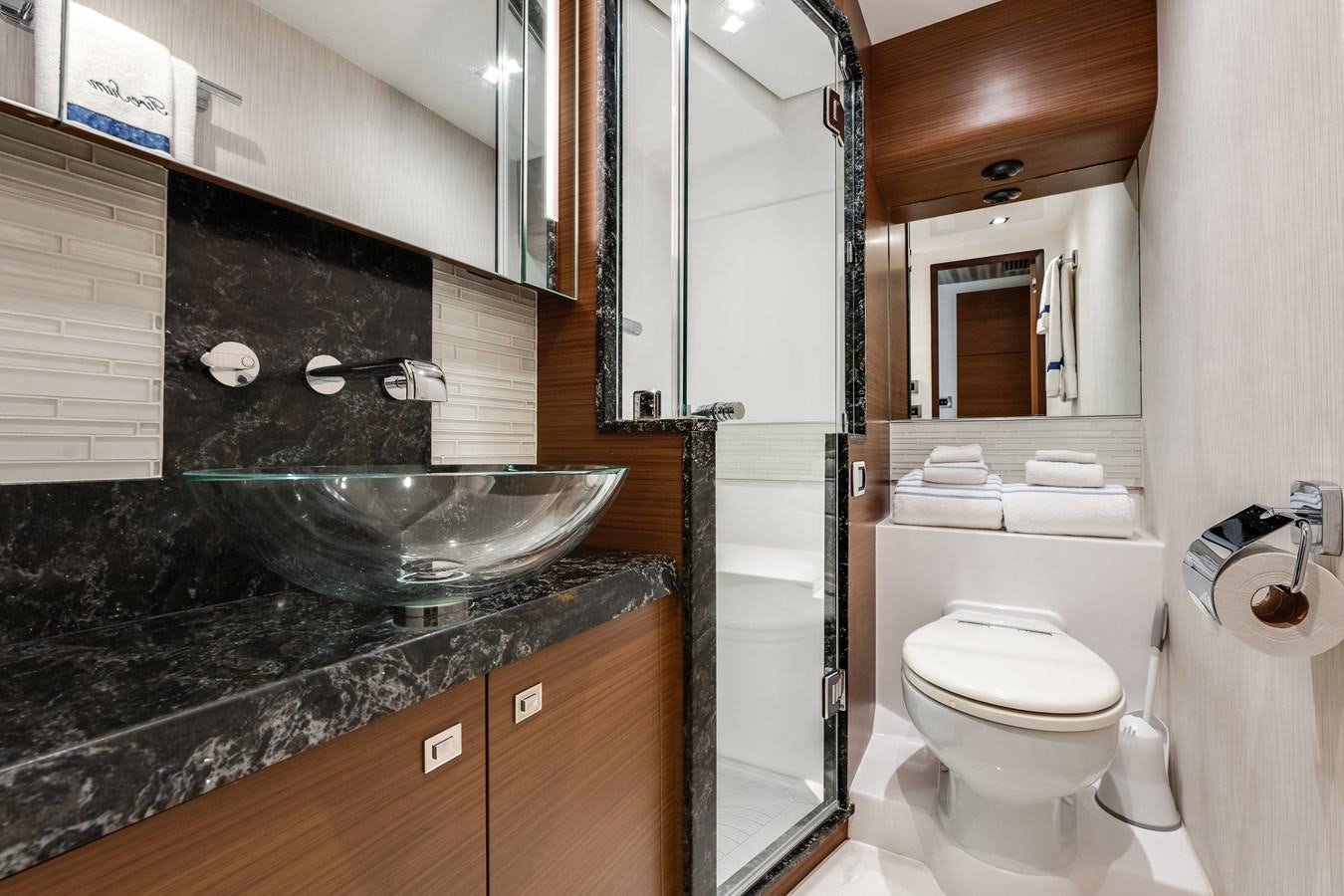 a bathroom with a marble countertop aboard 2018 OCEAN ALEXANDER 70E TIRESUM Yacht for Sale