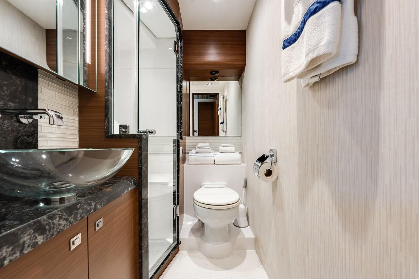 a bathroom with a sink and a toilet aboard 2018 OCEAN ALEXANDER 70E TIRESUM Yacht for Sale