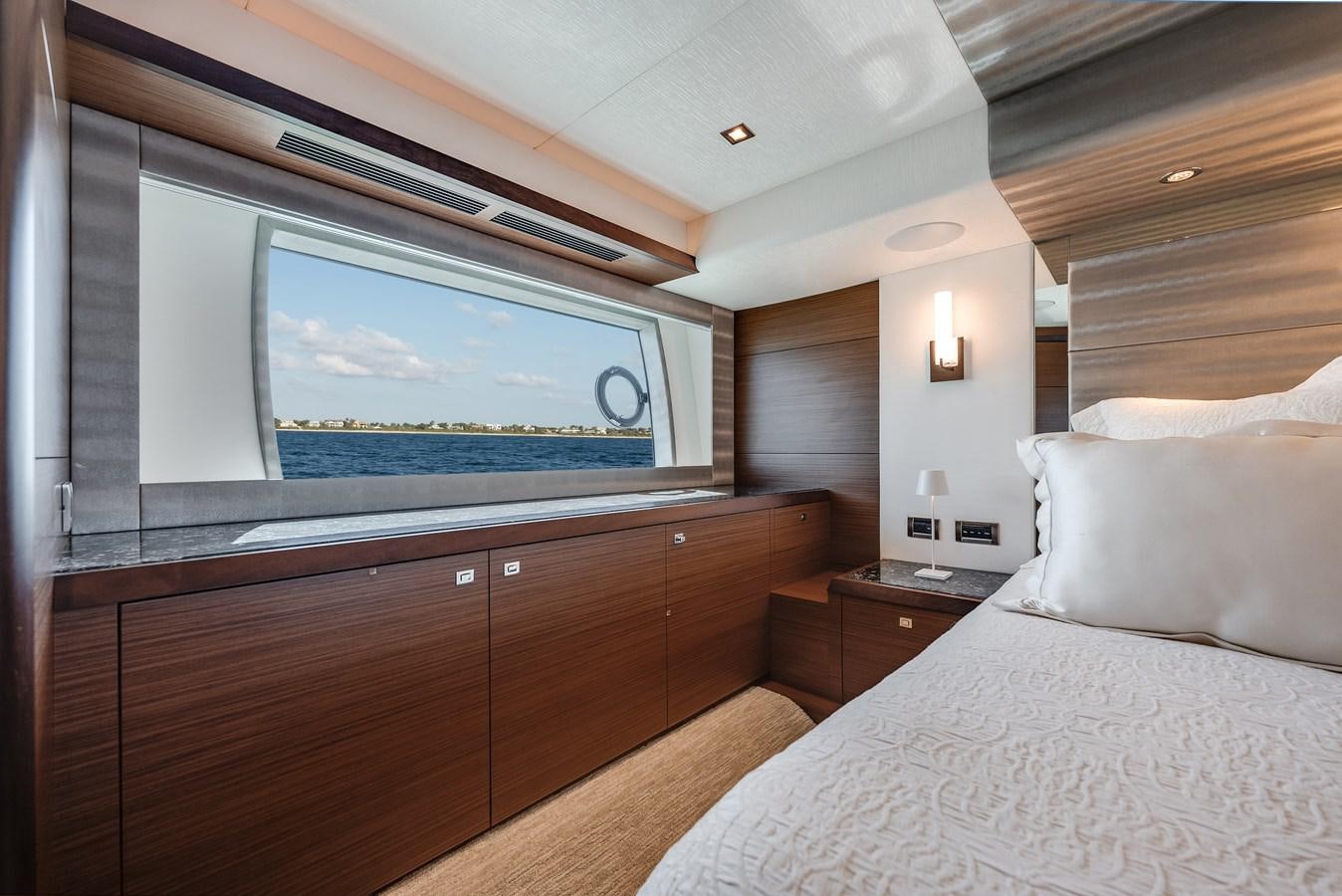 a bedroom with a large television aboard 2018 OCEAN ALEXANDER 70E TIRESUM Yacht for Sale