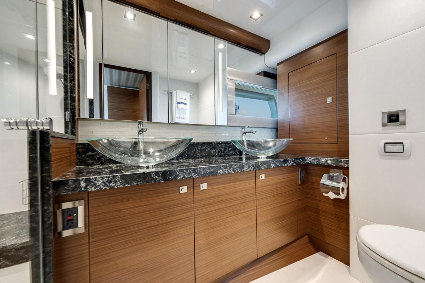 a kitchen with a sink and cabinets aboard 2018 OCEAN ALEXANDER 70E TIRESUM Yacht for Sale