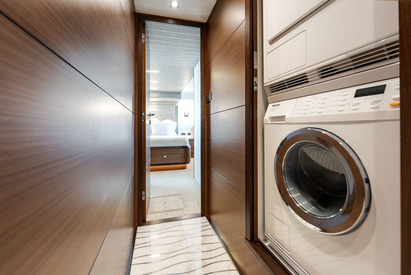 a room with a washer and dryer aboard 2018 OCEAN ALEXANDER 70E TIRESUM Yacht for Sale