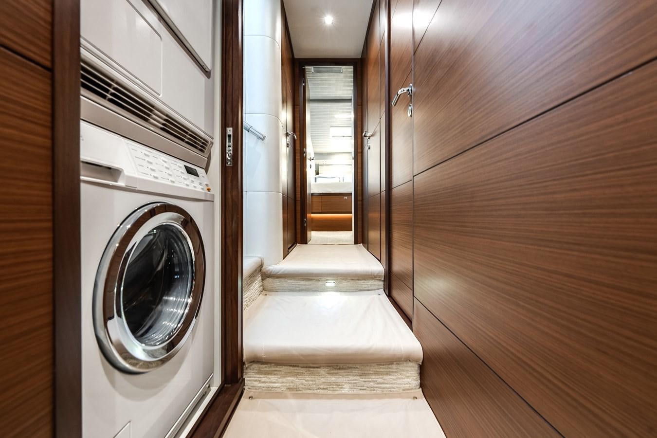 a room with a washer and dryer aboard 2018 OCEAN ALEXANDER 70E TIRESUM Yacht for Sale