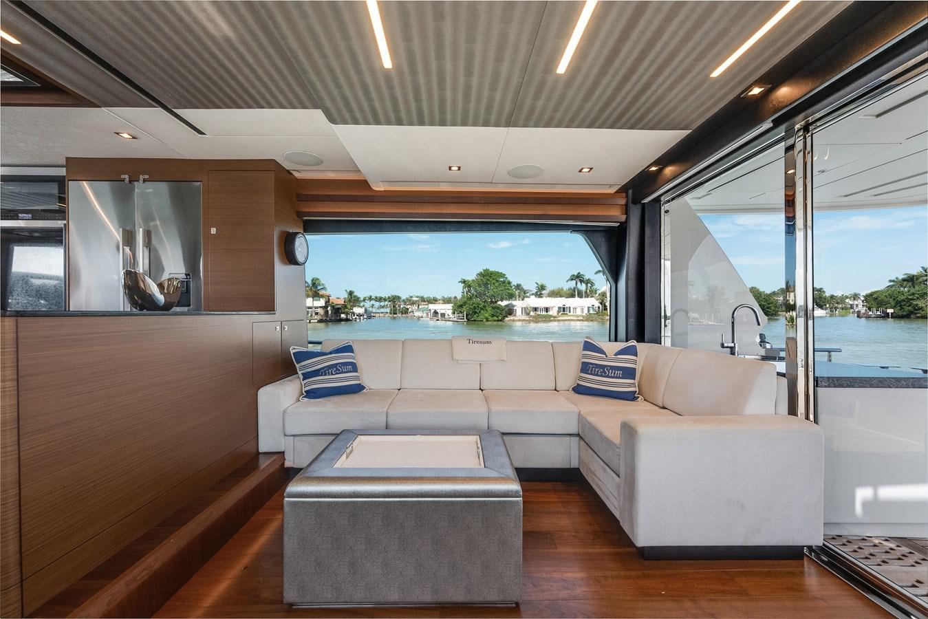 a room with a couch and a table aboard 2018 OCEAN ALEXANDER 70E TIRESUM Yacht for Sale