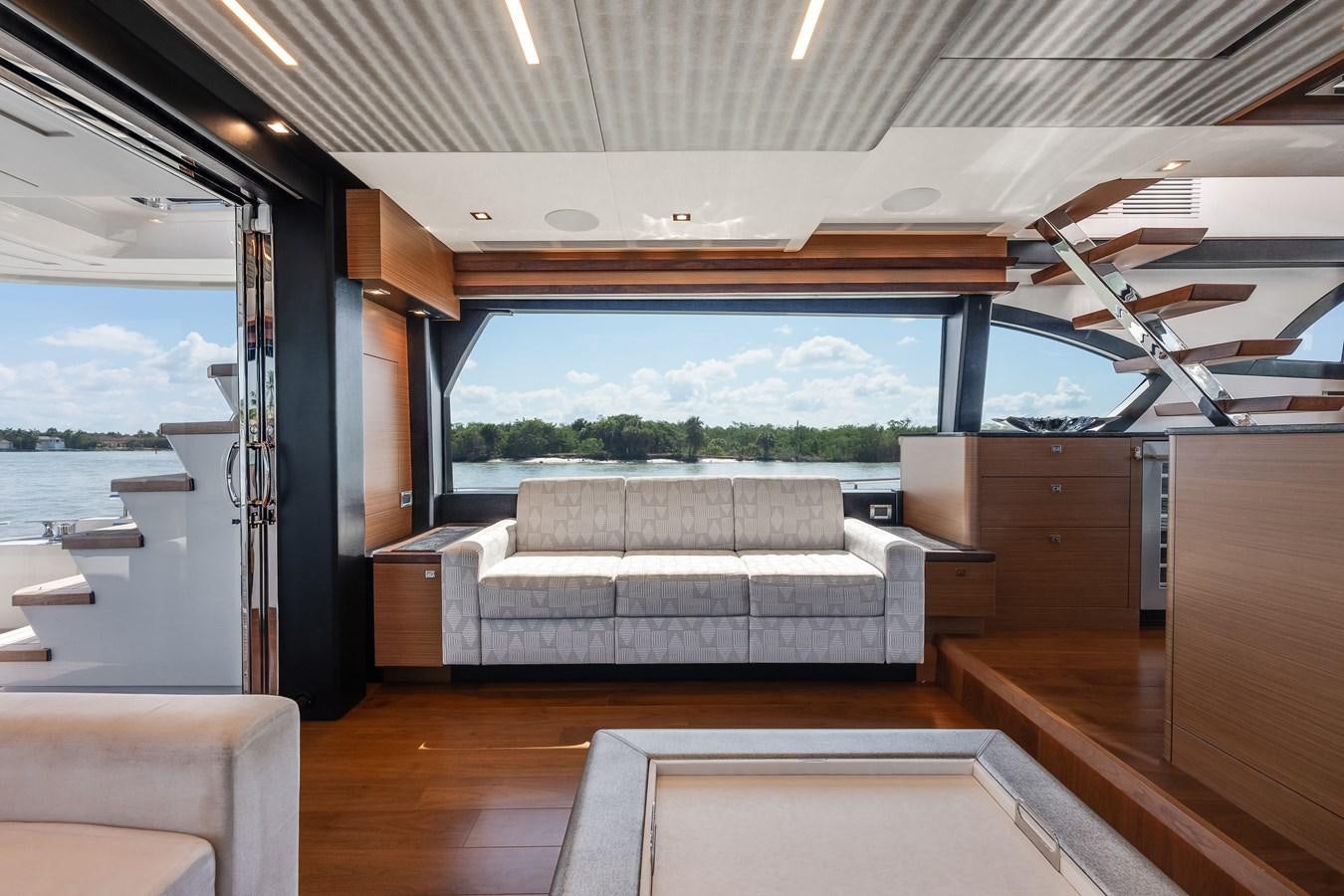 a room with a bed and a large window aboard 2018 OCEAN ALEXANDER 70E TIRESUM Yacht for Sale