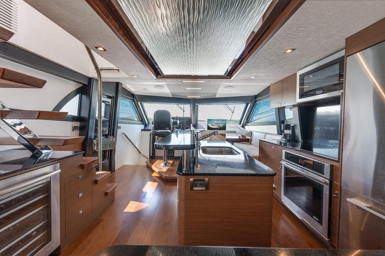 a room with a desk and a computer aboard 2018 OCEAN ALEXANDER 70E TIRESUM Yacht for Sale
