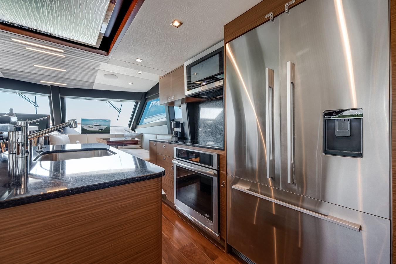 a kitchen with stainless steel appliances aboard 2018 OCEAN ALEXANDER 70E TIRESUM Yacht for Sale