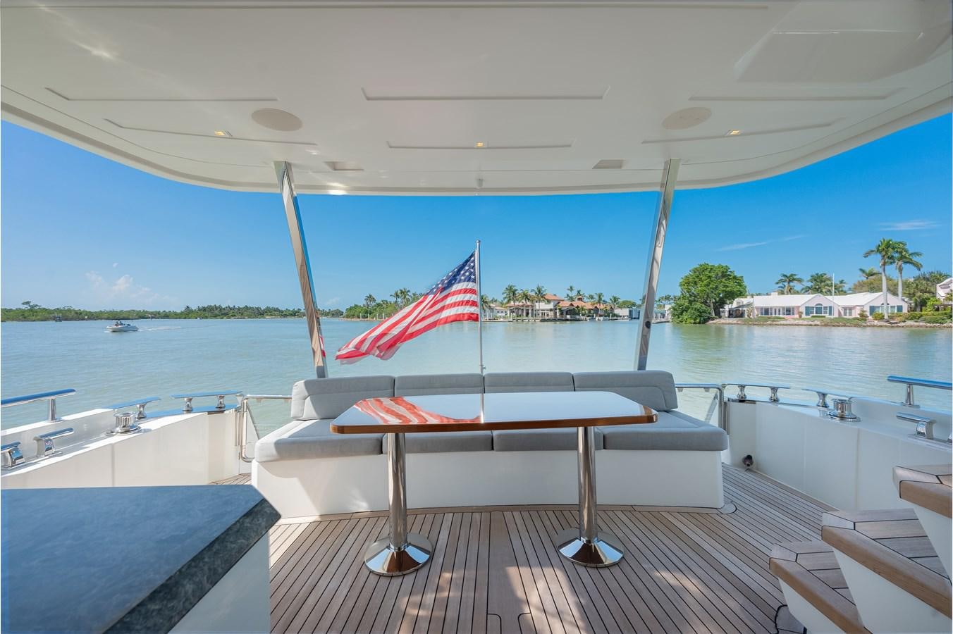 a boat with a flag on it aboard 2018 OCEAN ALEXANDER 70E TIRESUM Yacht for Sale