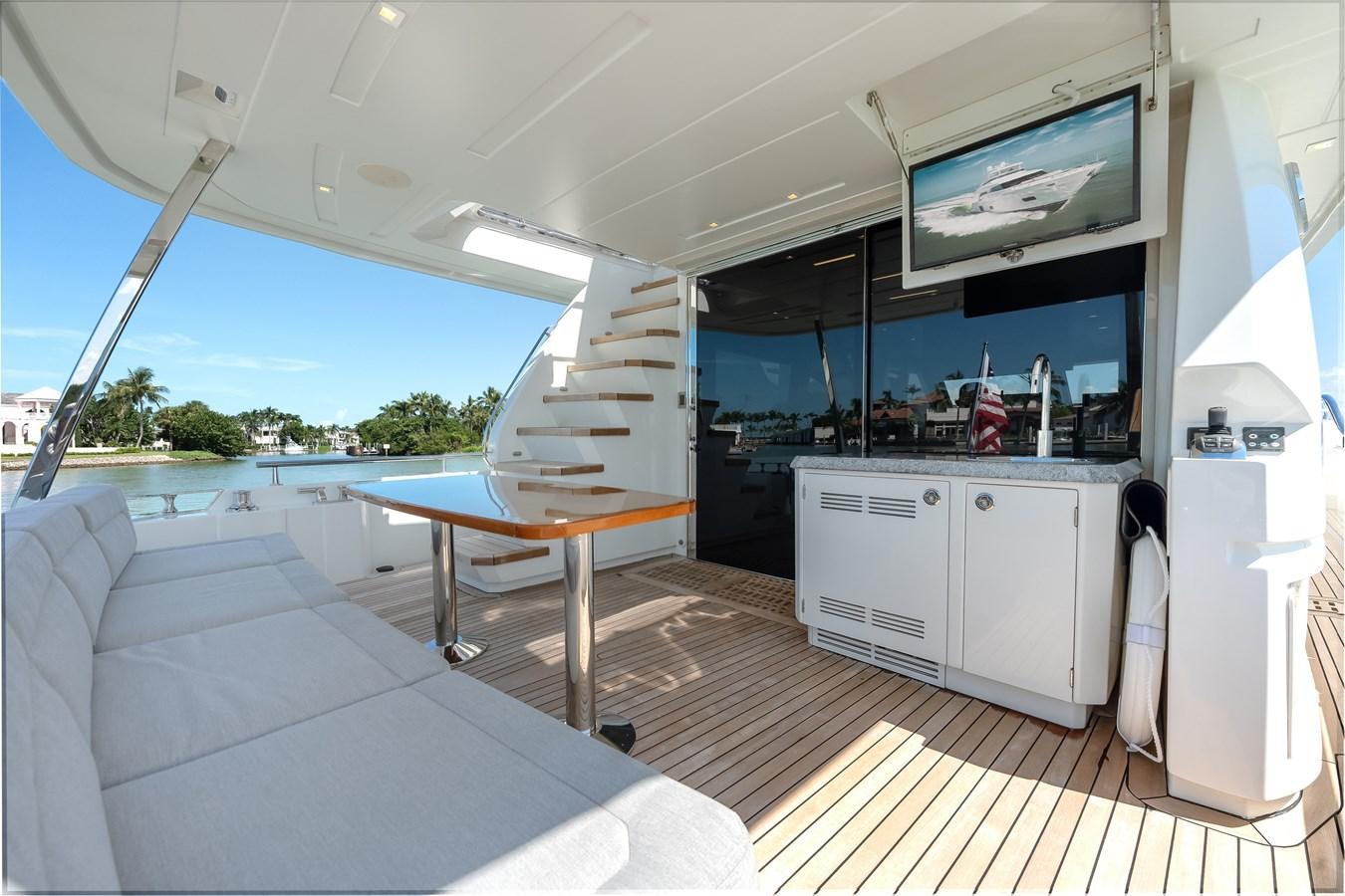 a room with a table and a couch aboard 2018 OCEAN ALEXANDER 70E TIRESUM Yacht for Sale