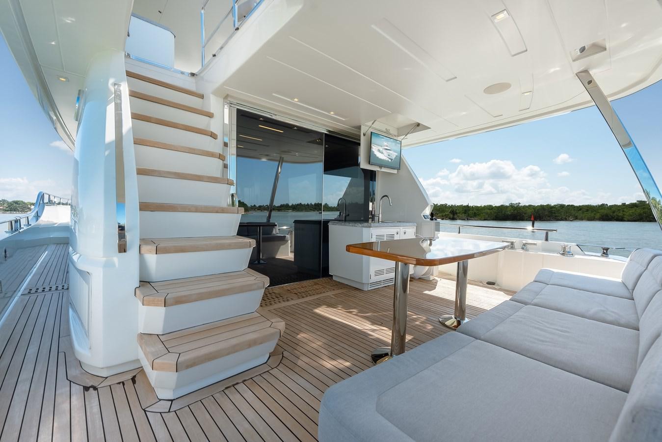 a room with a table and a couch aboard 2018 OCEAN ALEXANDER 70E TIRESUM Yacht for Sale
