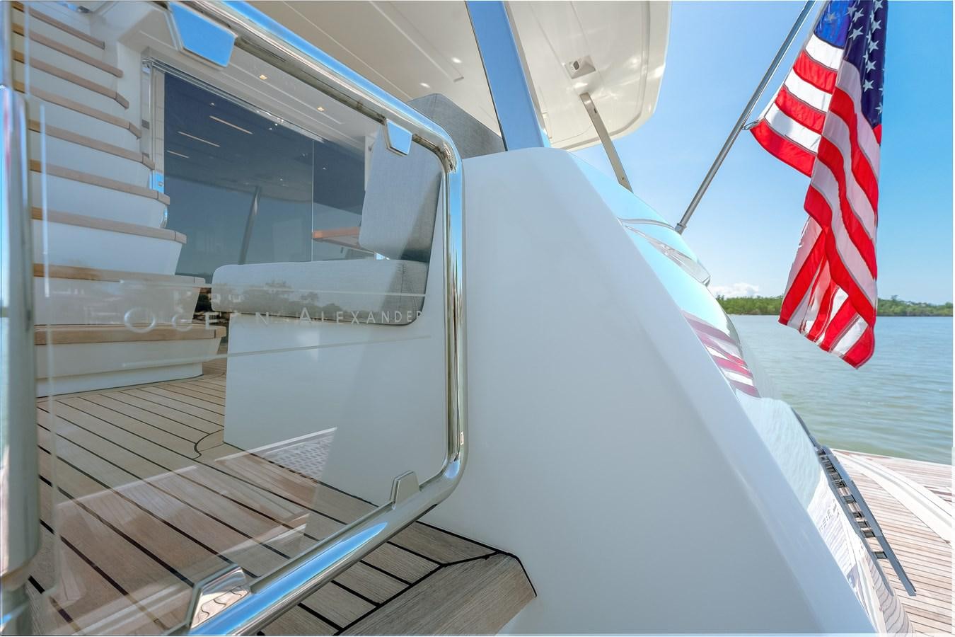 a boat with a flag on the front aboard 2018 OCEAN ALEXANDER 70E TIRESUM Yacht for Sale