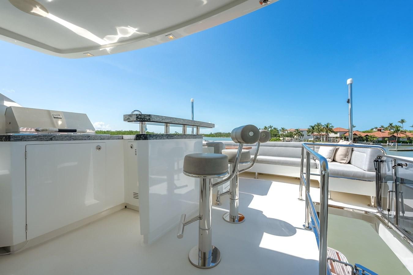 a deck with chairs and tables aboard 2018 OCEAN ALEXANDER 70E TIRESUM Yacht for Sale