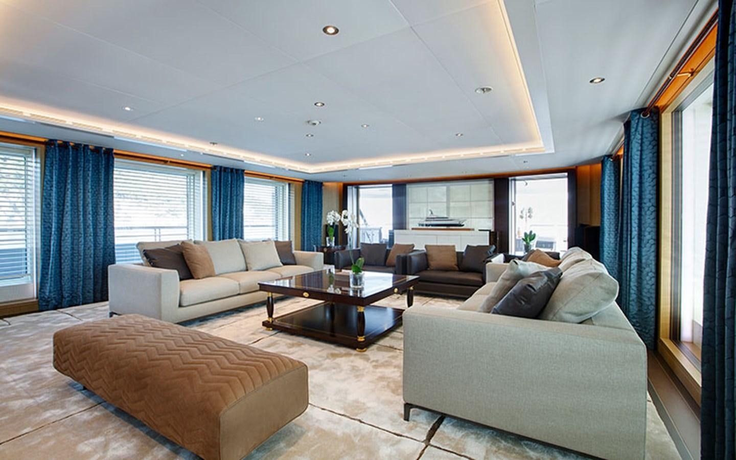 a living room with a couch and a coffee table aboard MARUN Yacht for Sale