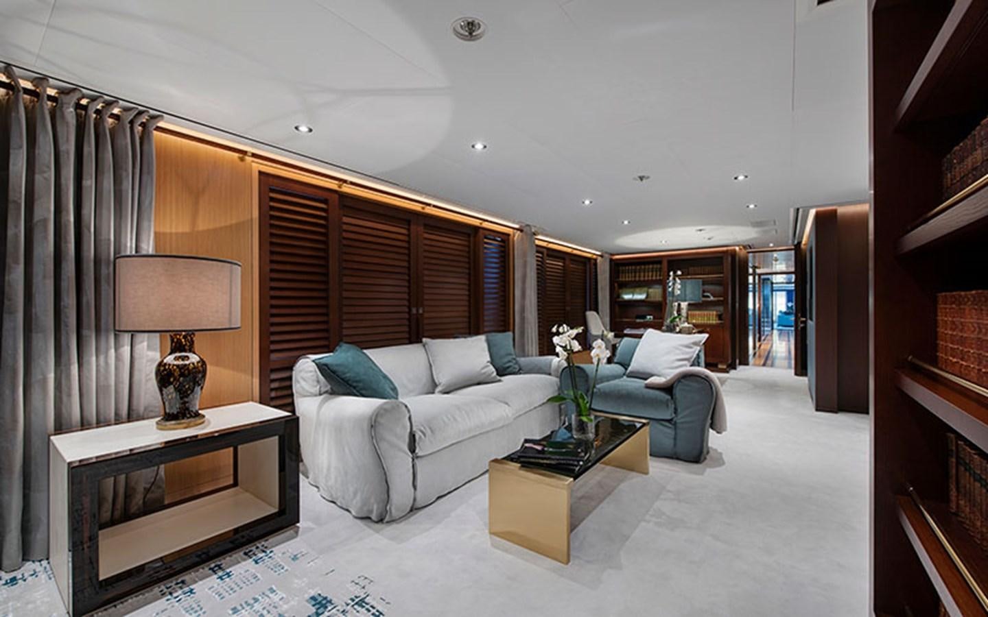 a living room with a white couch and a table aboard MARUN Yacht for Sale