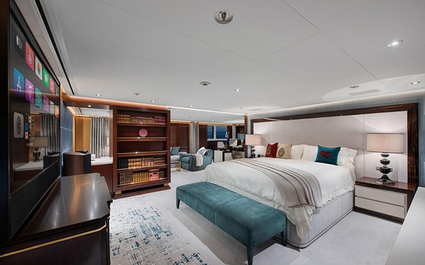 a bedroom with a bed and a desk aboard MARUN Yacht for Sale