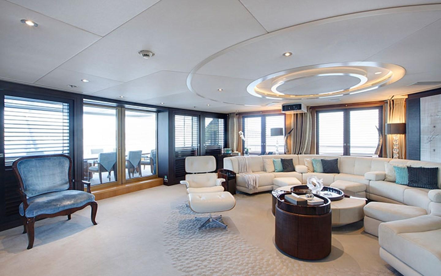 a living room with a large chandelier aboard MARUN Yacht for Sale