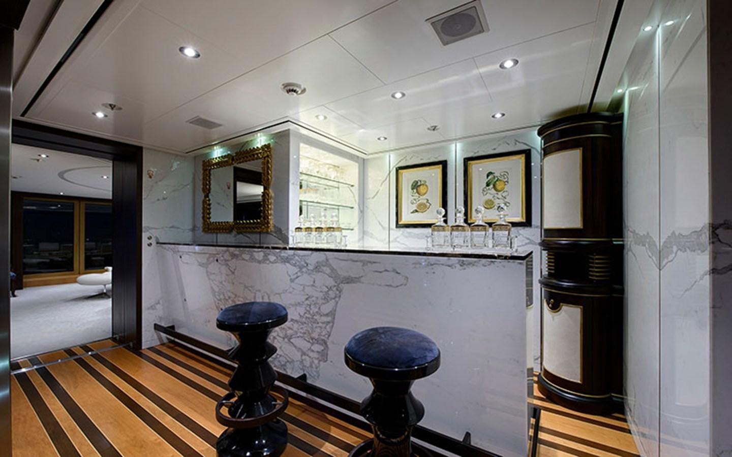 a room with a table and chairs aboard MARUN Yacht for Sale