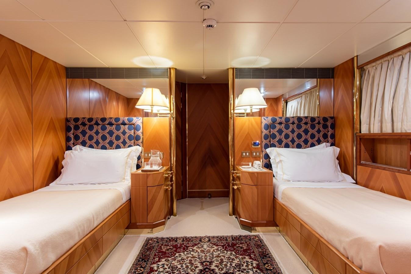 a room with two beds aboard SHEERGOLD Yacht for Sale