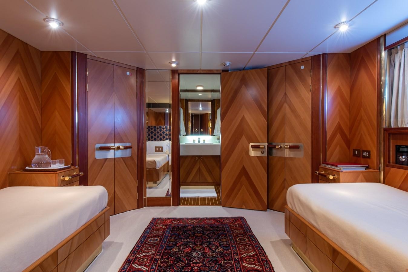 a bathroom with a bed and a sink aboard SHEERGOLD Yacht for Sale