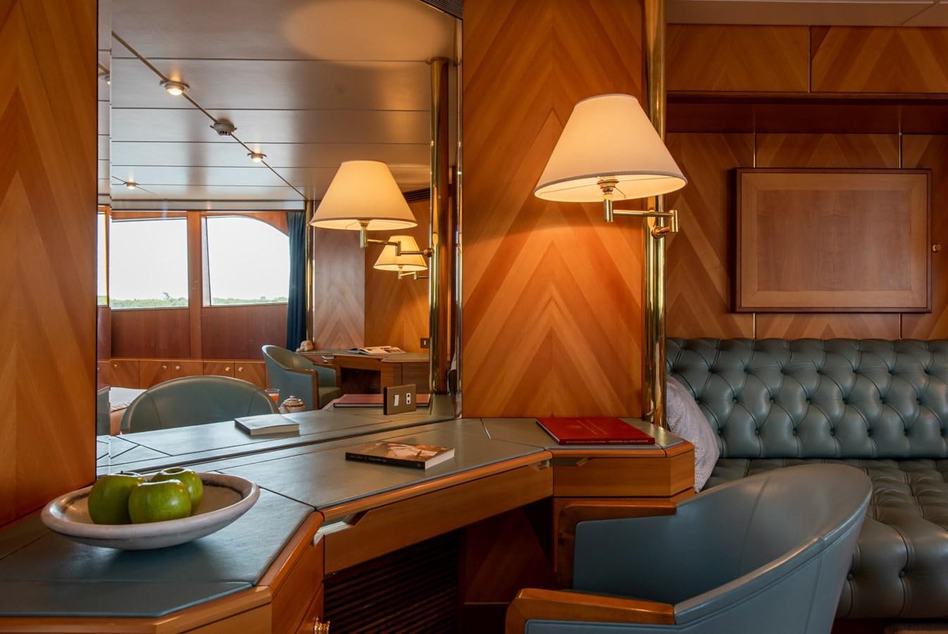 a room with a table and chairs aboard SHEERGOLD Yacht for Sale
