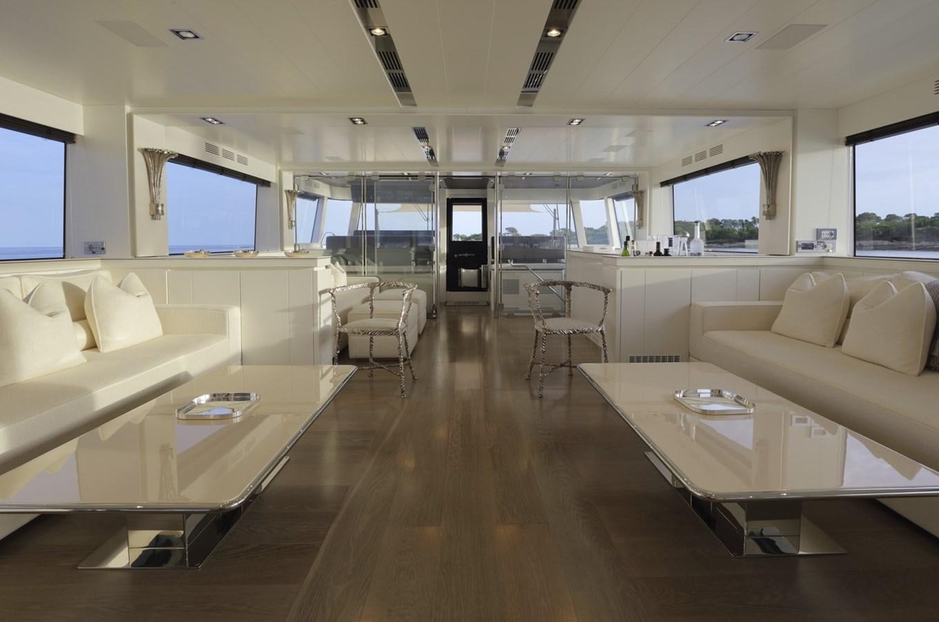 a room with a couch and a table aboard ALEXANDRA Yacht for Sale