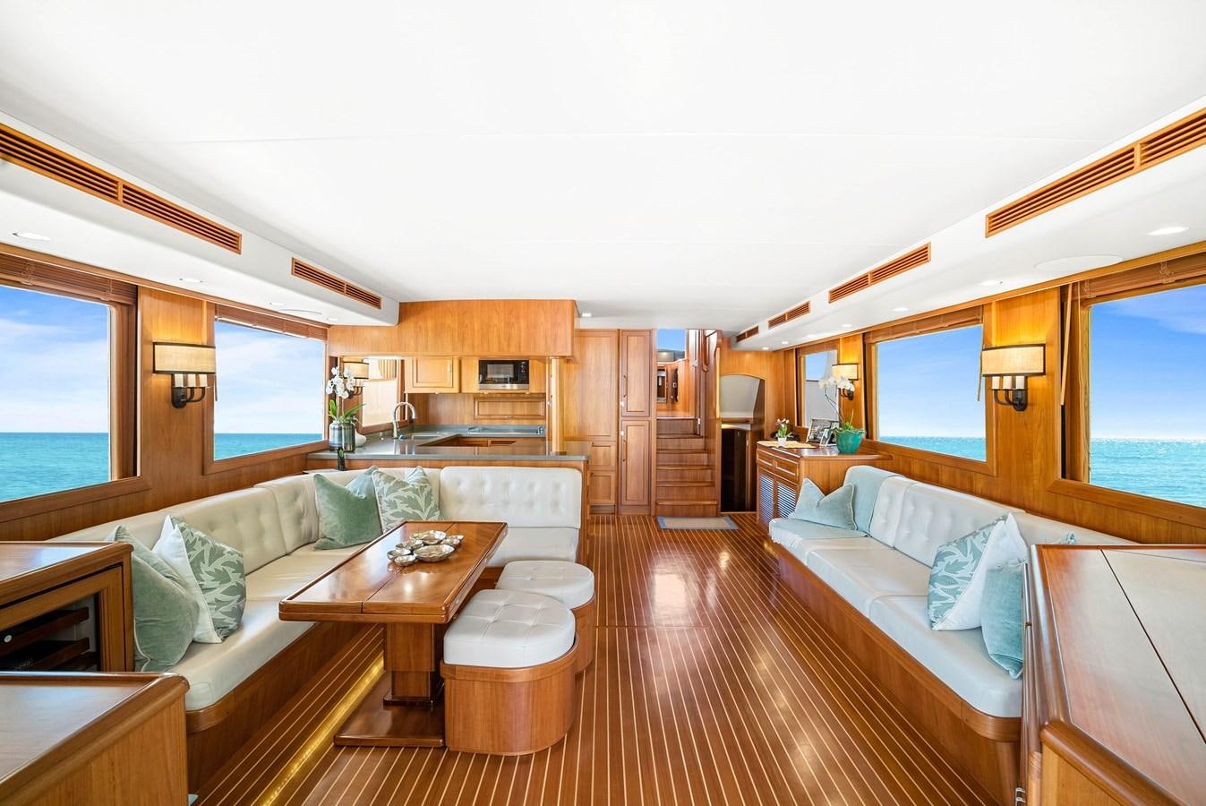 a living room with a couch and a table aboard FLEMING 78 - CLASSIC FLYBRIDGE Yacht for Sale