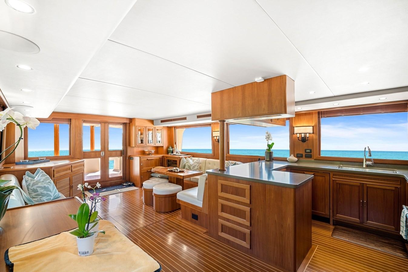 a large kitchen with wooden cabinets aboard FLEMING 78 - CLASSIC FLYBRIDGE Yacht for Sale