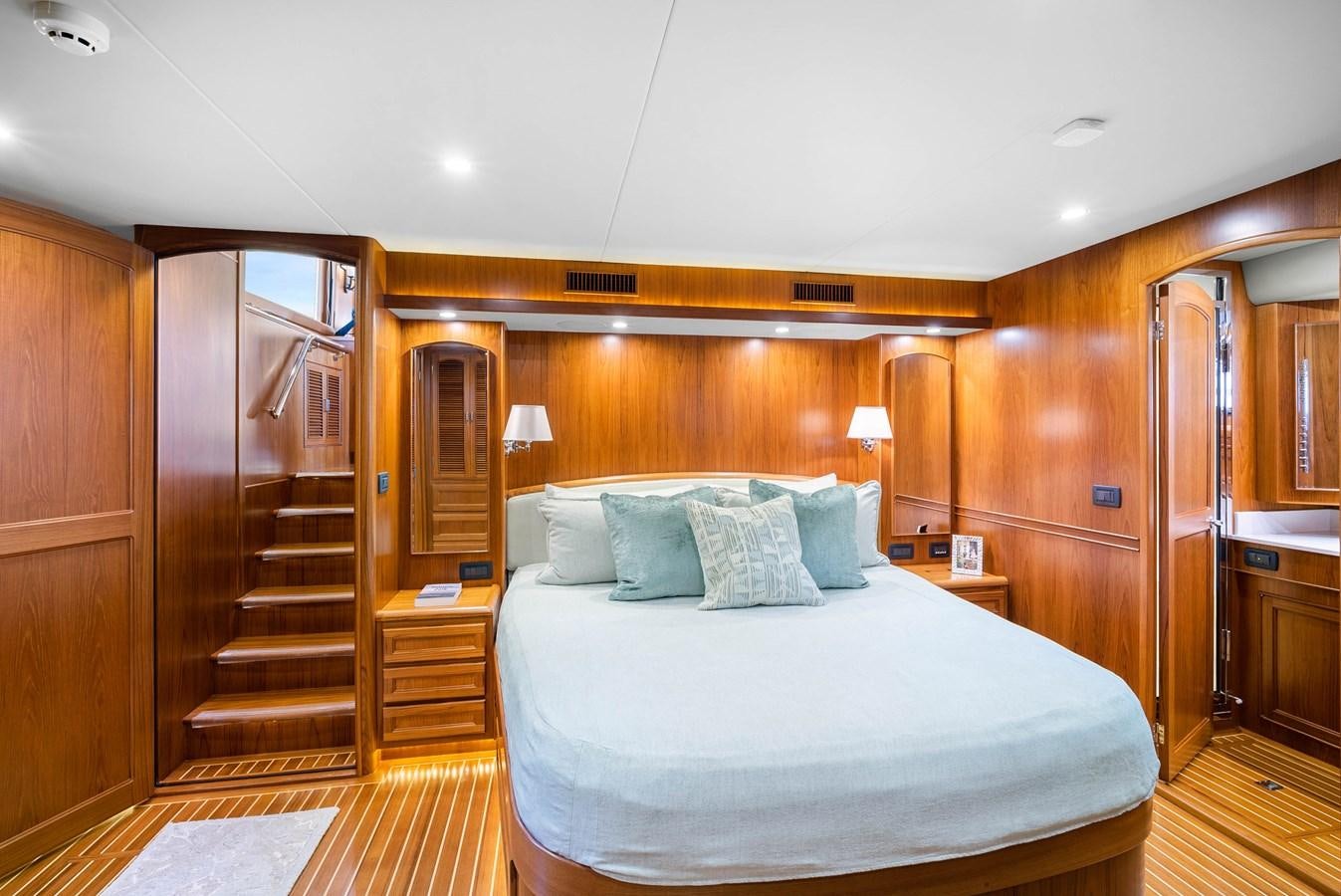 a large bed in a room aboard FLEMING 78 - CLASSIC FLYBRIDGE Yacht for Sale