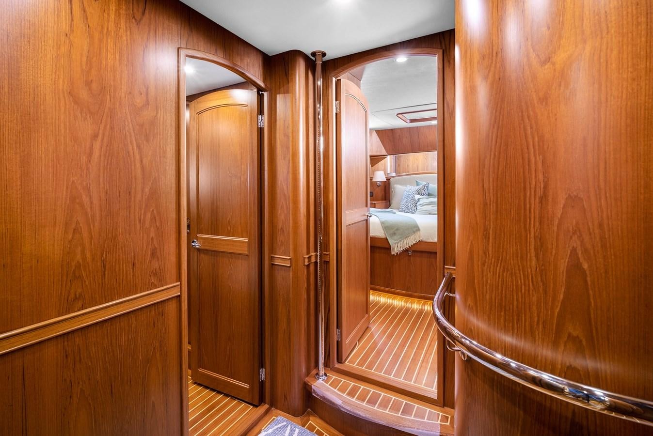 a bathroom with wooden cabinets aboard FLEMING 78 - CLASSIC FLYBRIDGE Yacht for Sale
