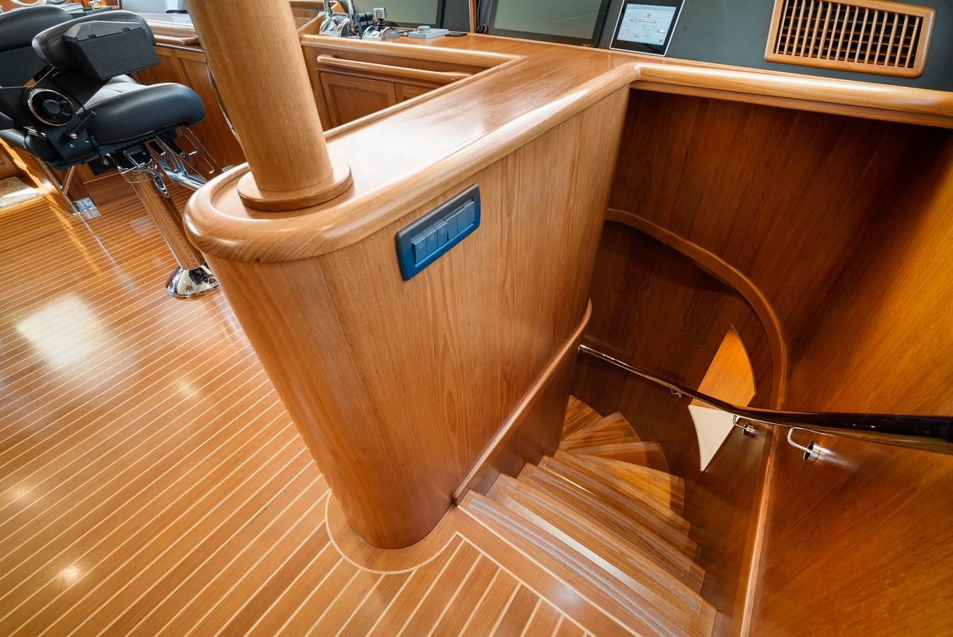 a wooden table with a blue handle aboard FLEMING 78 - CLASSIC FLYBRIDGE Yacht for Sale