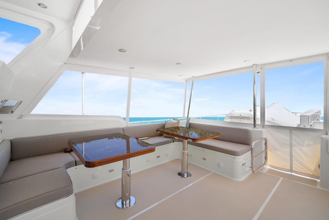 a room with a bed and a table aboard FLEMING 78 - CLASSIC FLYBRIDGE Yacht for Sale