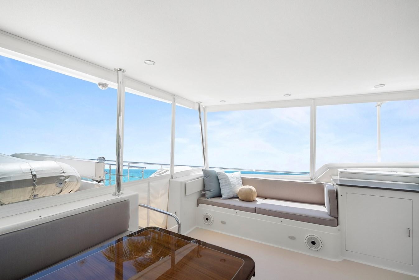 a room with a bed and a window aboard FLEMING 78 - CLASSIC FLYBRIDGE Yacht for Sale