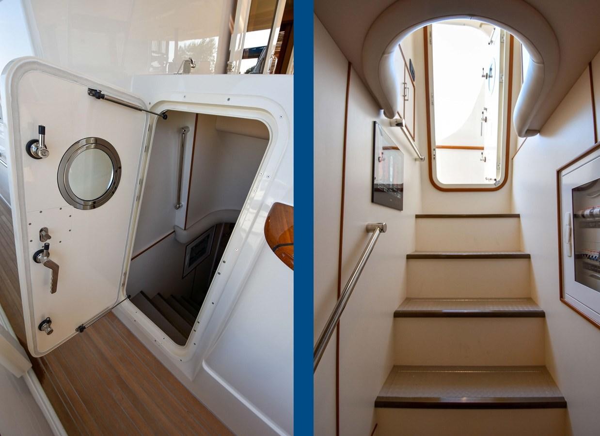 a white room with a slide aboard FLEMING 78 - CLASSIC FLYBRIDGE Yacht for Sale