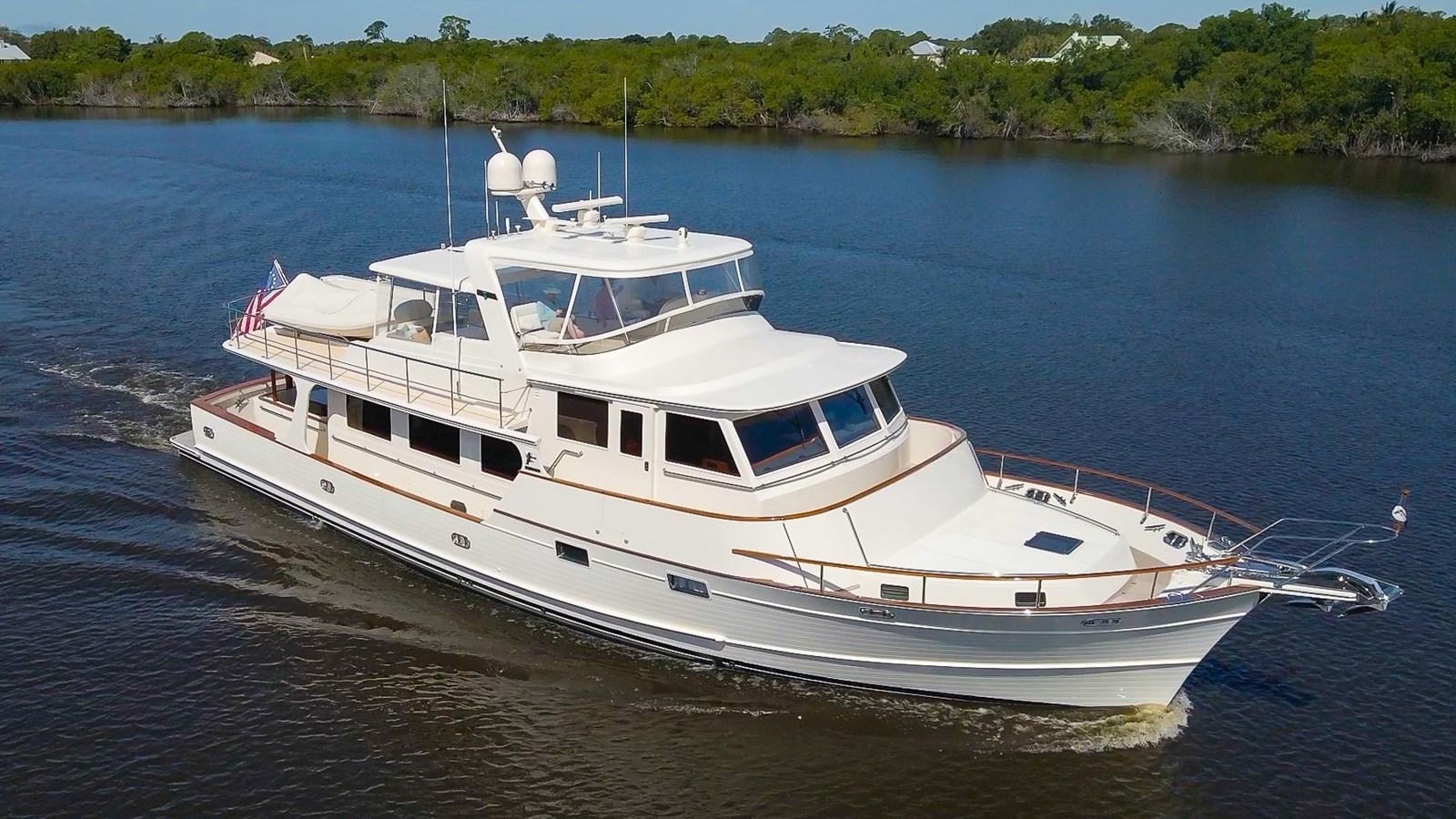 a white boat on the water aboard FLEMING 78 - CLASSIC FLYBRIDGE Yacht for Sale