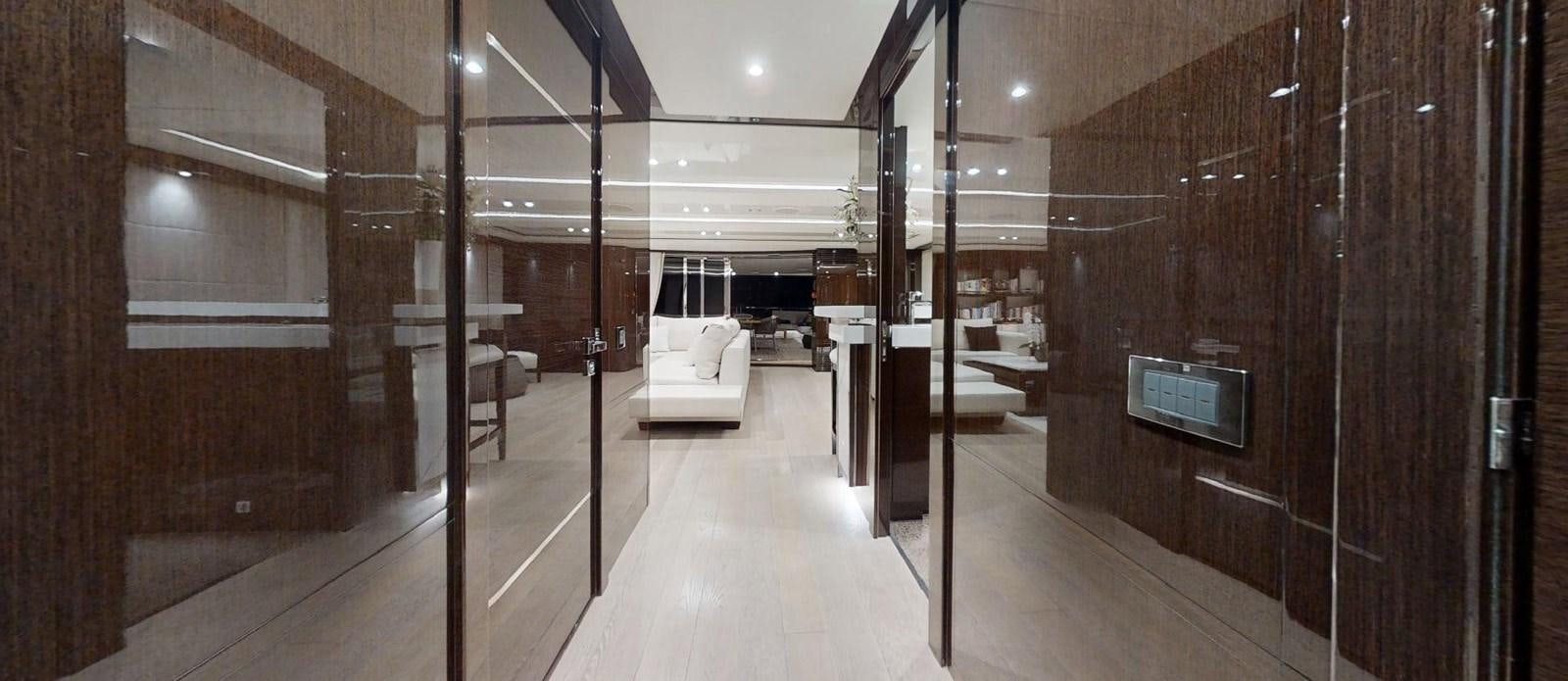 a room with a bed and a couch aboard ROGUE Yacht for Sale