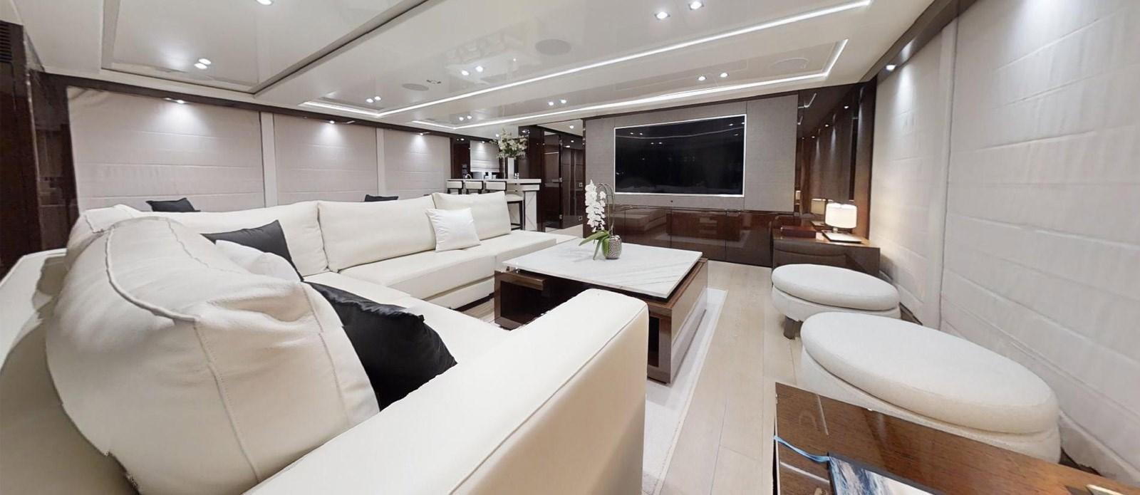 a room with a bed and a table aboard ROGUE Yacht for Sale