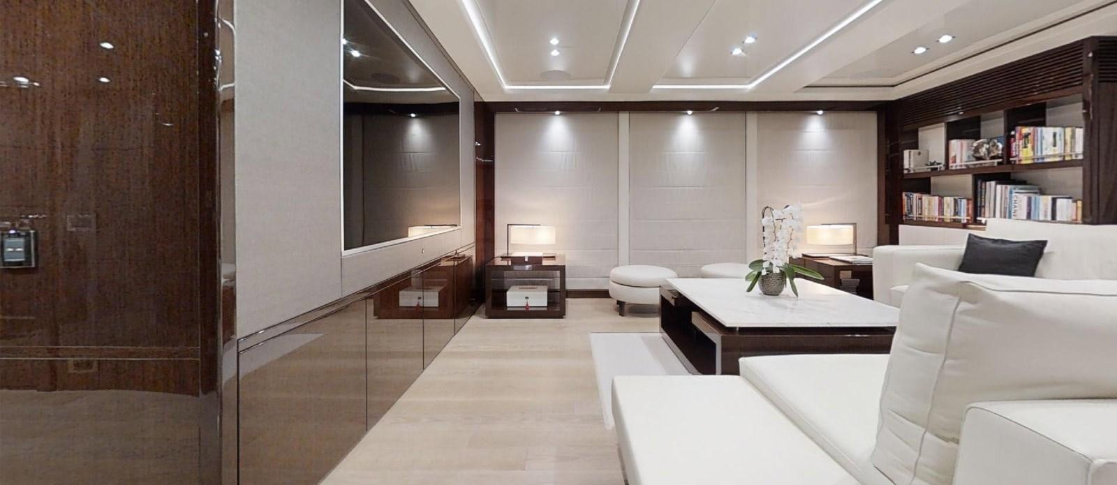 a room with a couch and a table aboard ROGUE Yacht for Sale