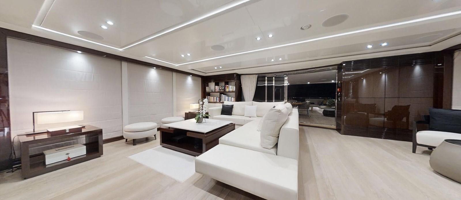 a room with a couch and a table and a tv aboard ROGUE Yacht for Sale