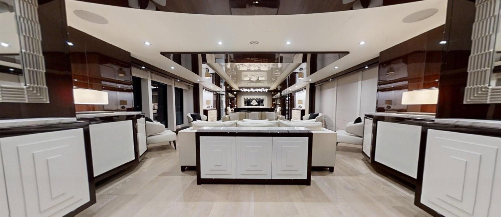 a room with a bed and a desk aboard ROGUE Yacht for Sale