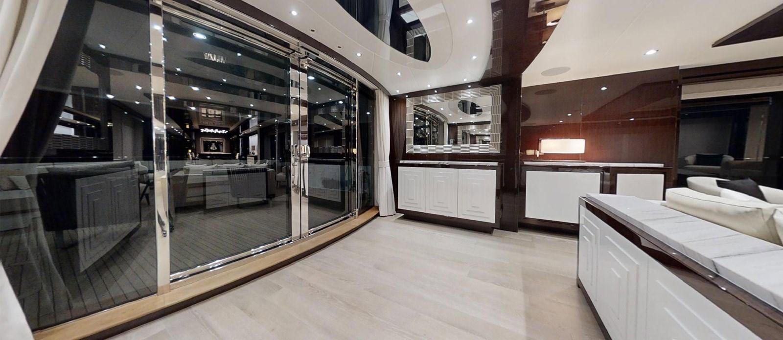 a room with a bed and a desk aboard ROGUE Yacht for Sale