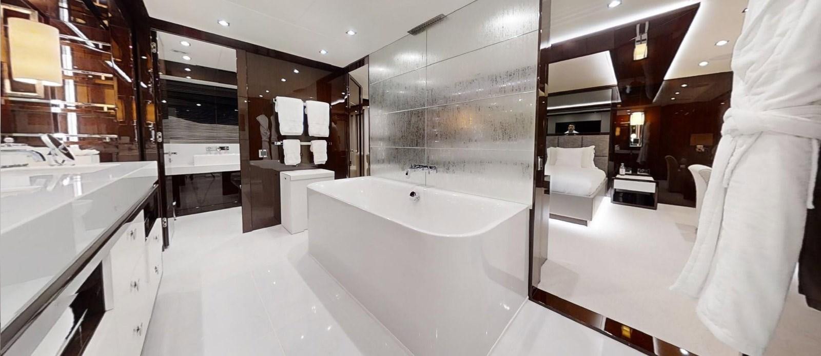 a bathroom with a bathtub and a sink aboard ROGUE Yacht for Sale