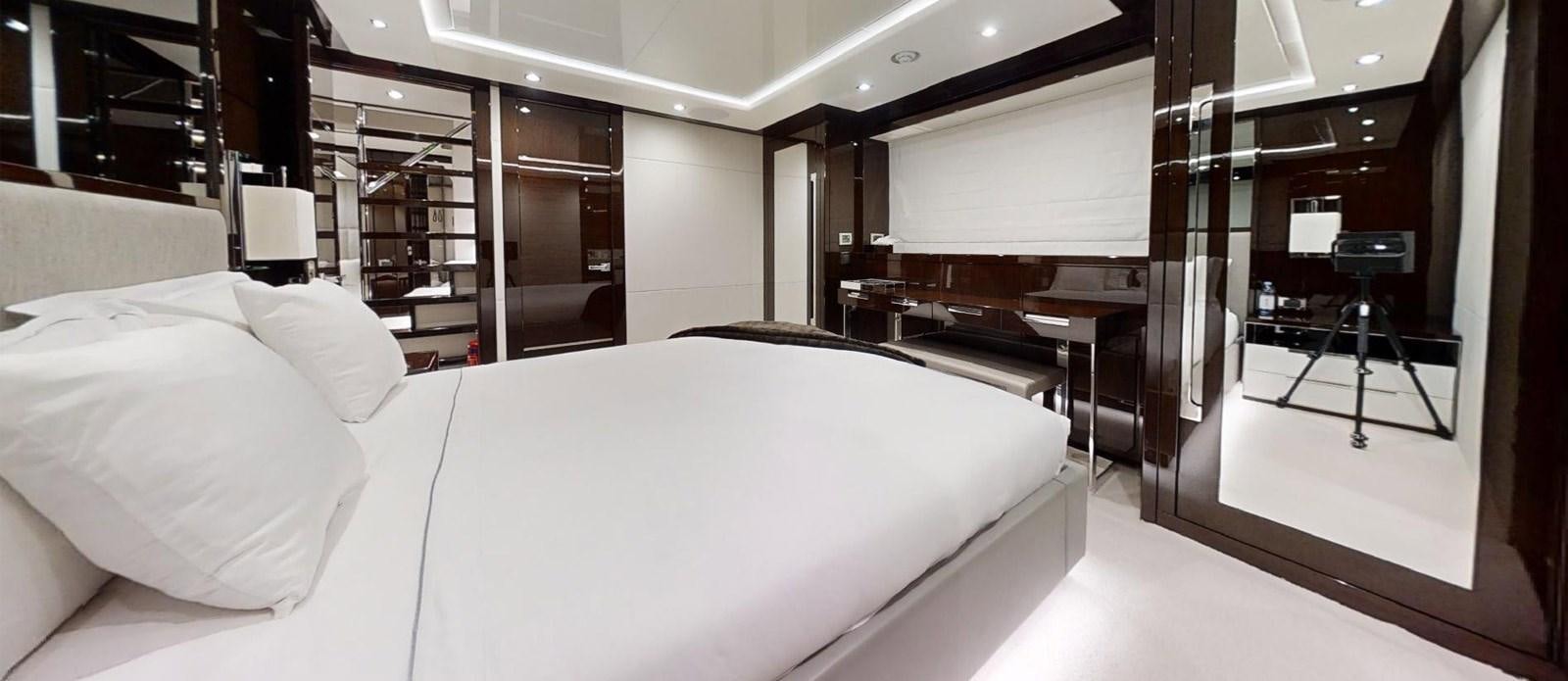 a bed in a room aboard ROGUE Yacht for Sale