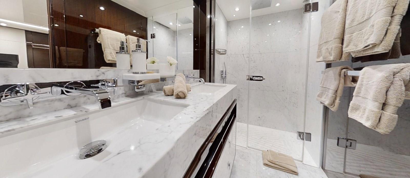 a bathroom with a large bathtub aboard ROGUE Yacht for Sale