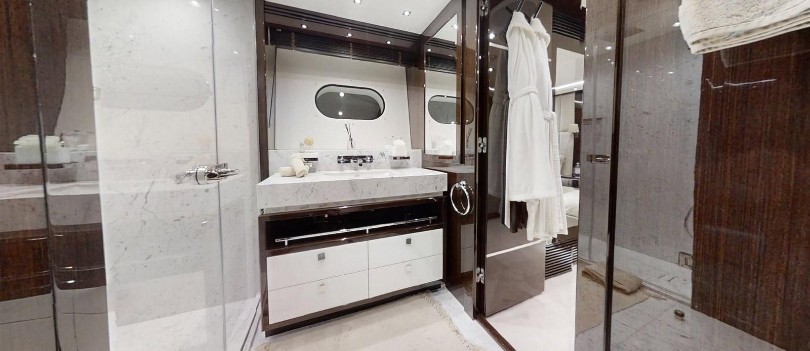 a bathroom with a shower unit and sink aboard ROGUE Yacht for Sale