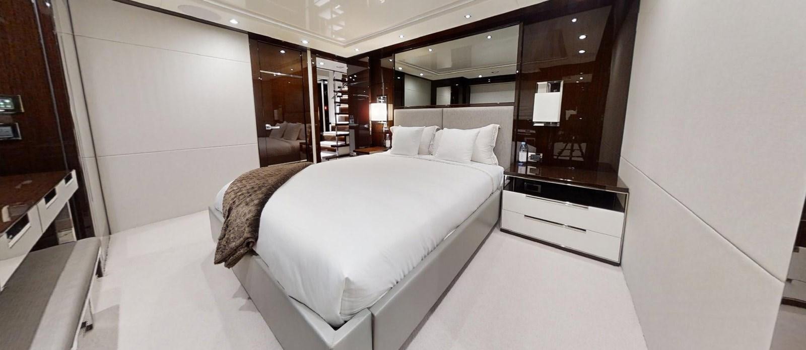 a room with two beds aboard ROGUE Yacht for Sale