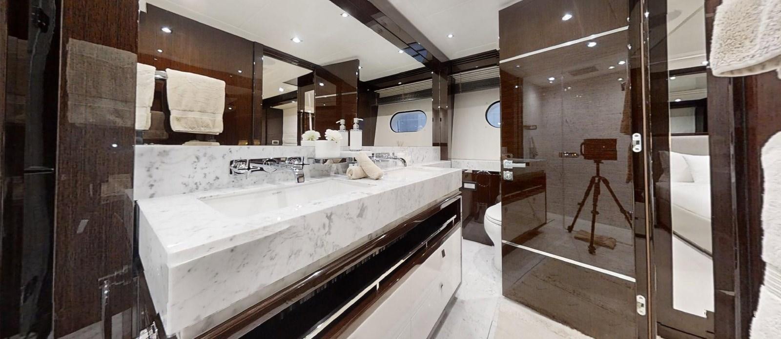 a bathroom with a sink and a mirror aboard ROGUE Yacht for Sale